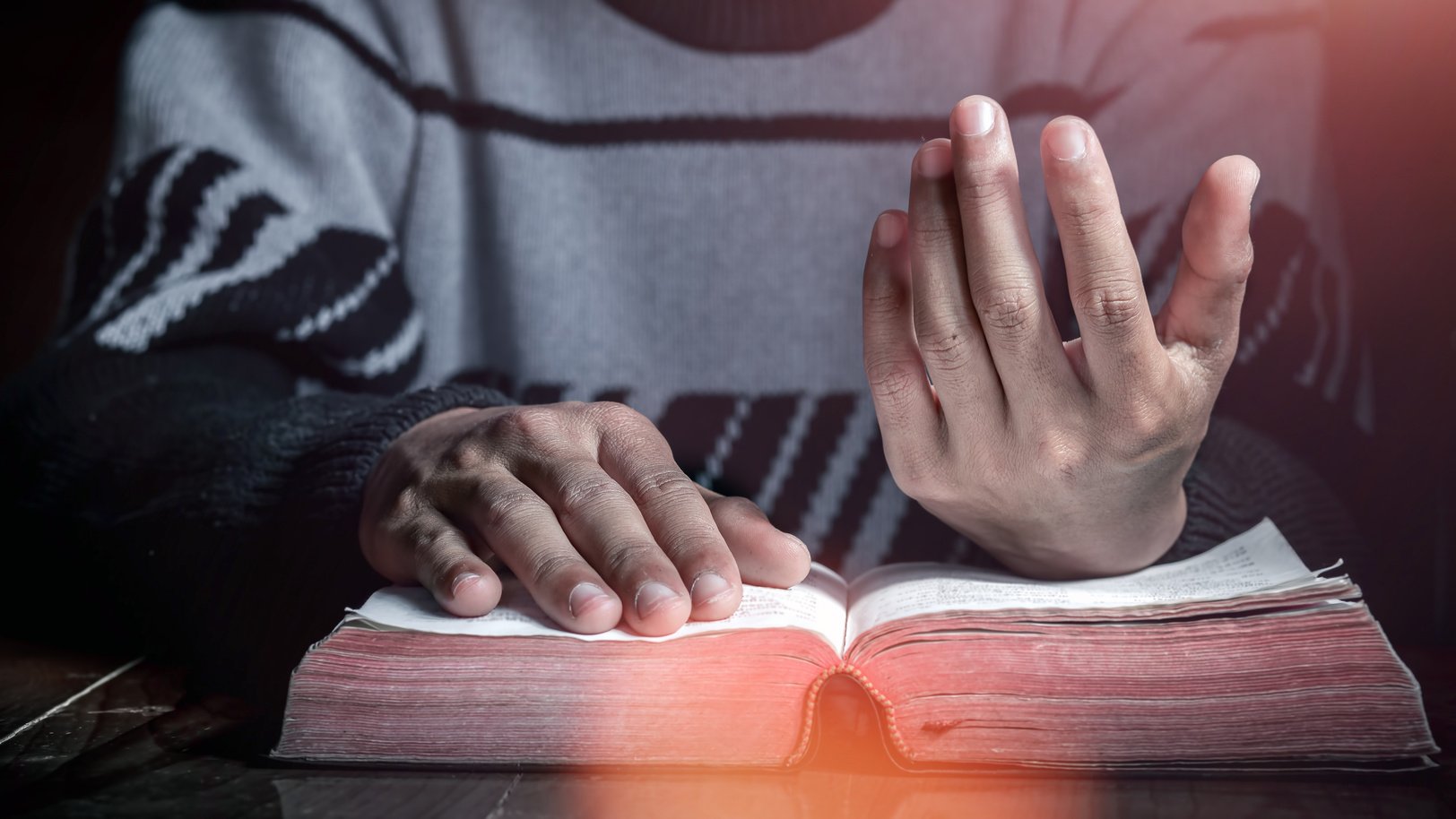 Praying and reading on bible, close up hands. christian concept.